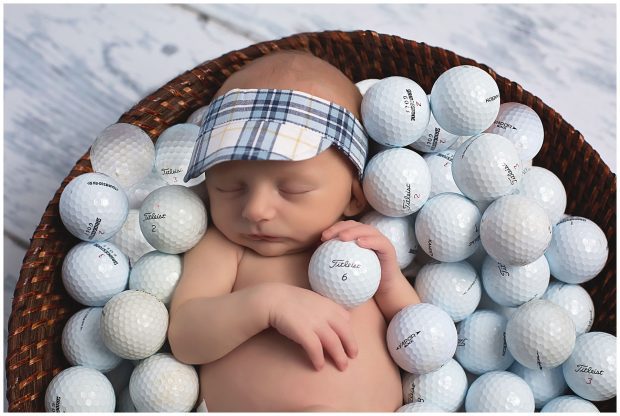 Newborn boy with golf balls at Whitney D Photography in Conway Arkansas