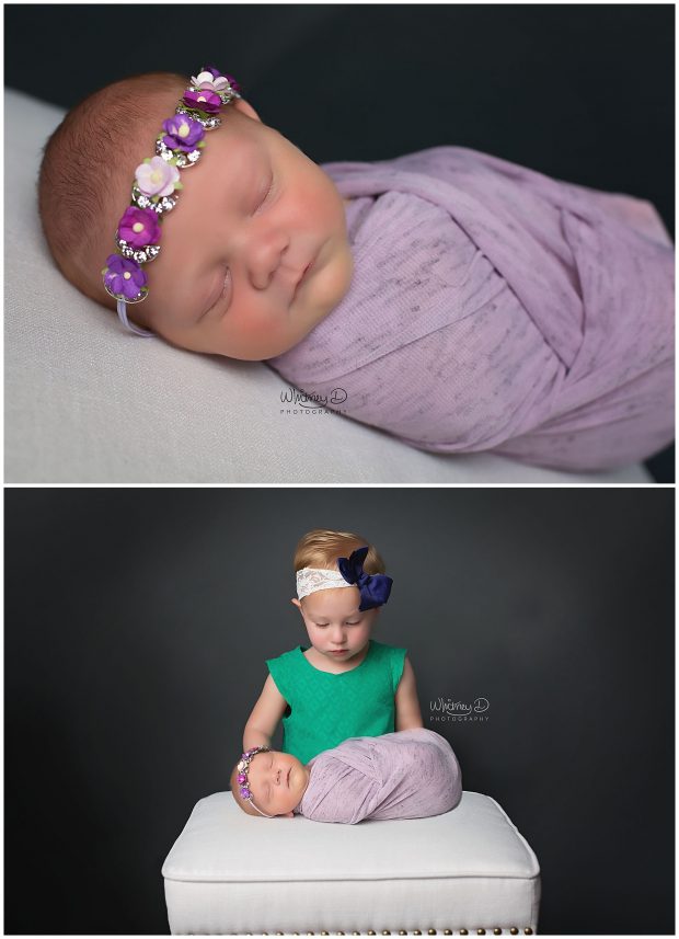 Newborn in purple wrap with toddler sister
