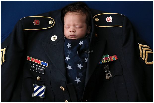 Newborn baby in dad's air force military uniform at Whitney D. Photography in Conway, Arkansas