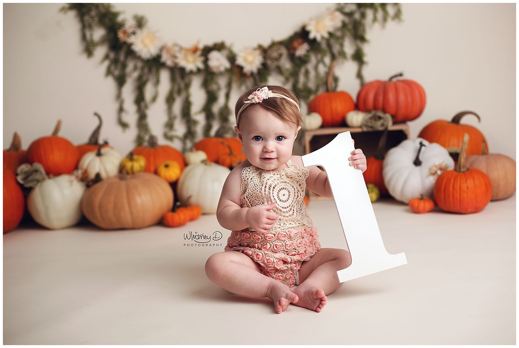 Birthday baby girl with pumpkins at Whitney D. Photography in Conway, Arkansas