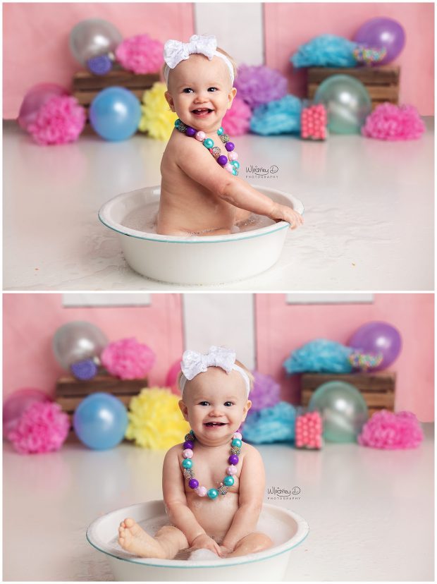 Baby girl splashing in tub at first birthday session at Whitney D. Photography in Conway, Arkansas