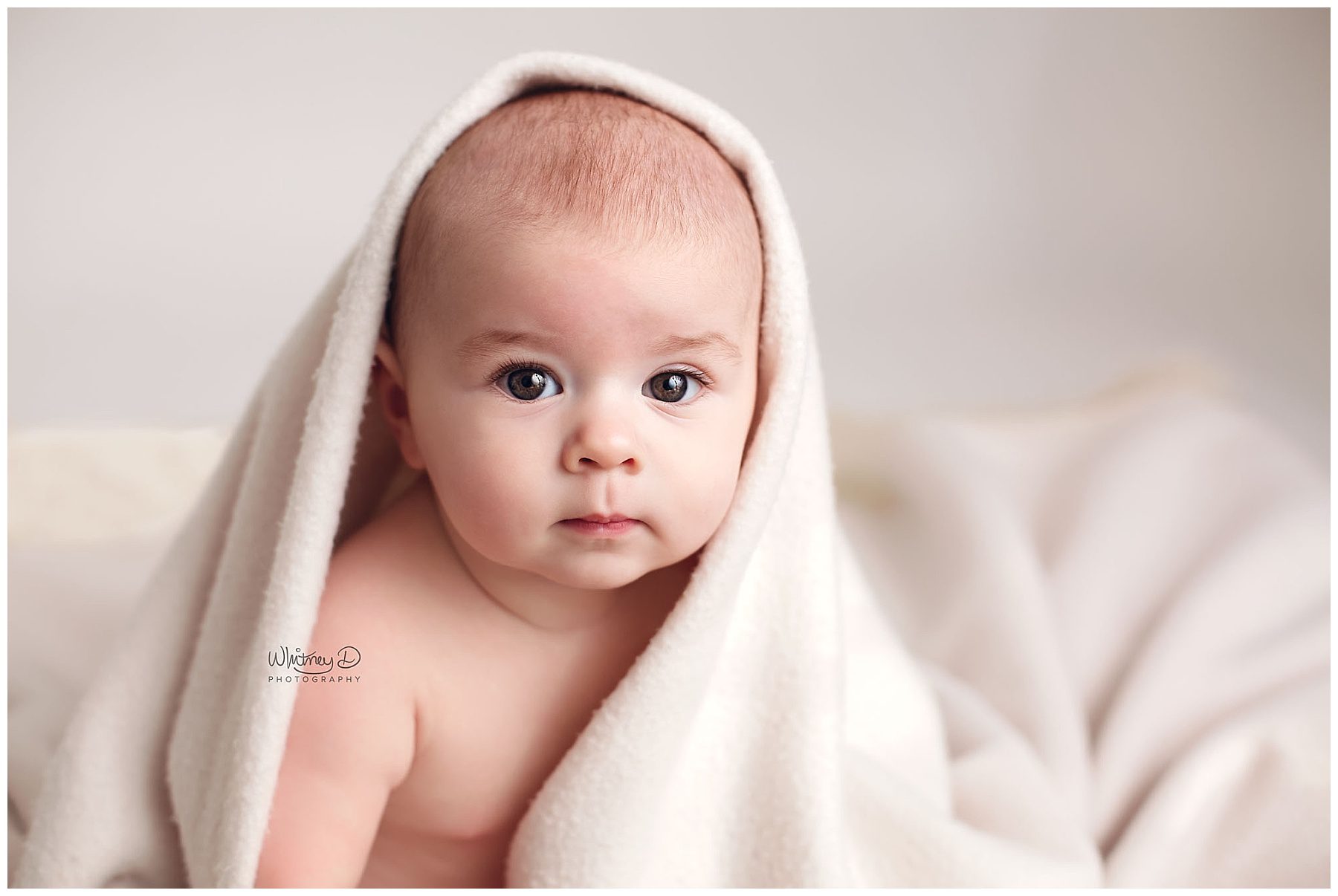 Baby boy posed under blanket at Whitney D. Photography in Conway, Arkansas
