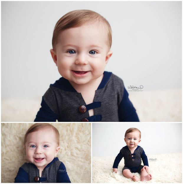 Six month baby boy smiling on white backdrop at Whitney D. Photography in Conway, Arkansas