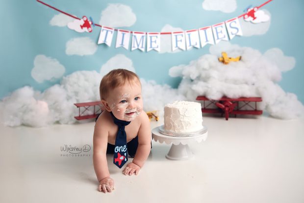 Baby boy's time flies first birthday cake smash at Whitney D. Photography in Conway, Arkansas