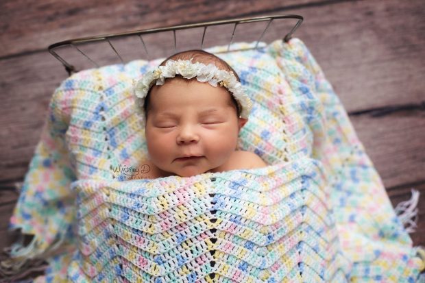 Newborn baby girl sleeping on handmade blanket at Whitney D. Photography in Conway, Arkansas