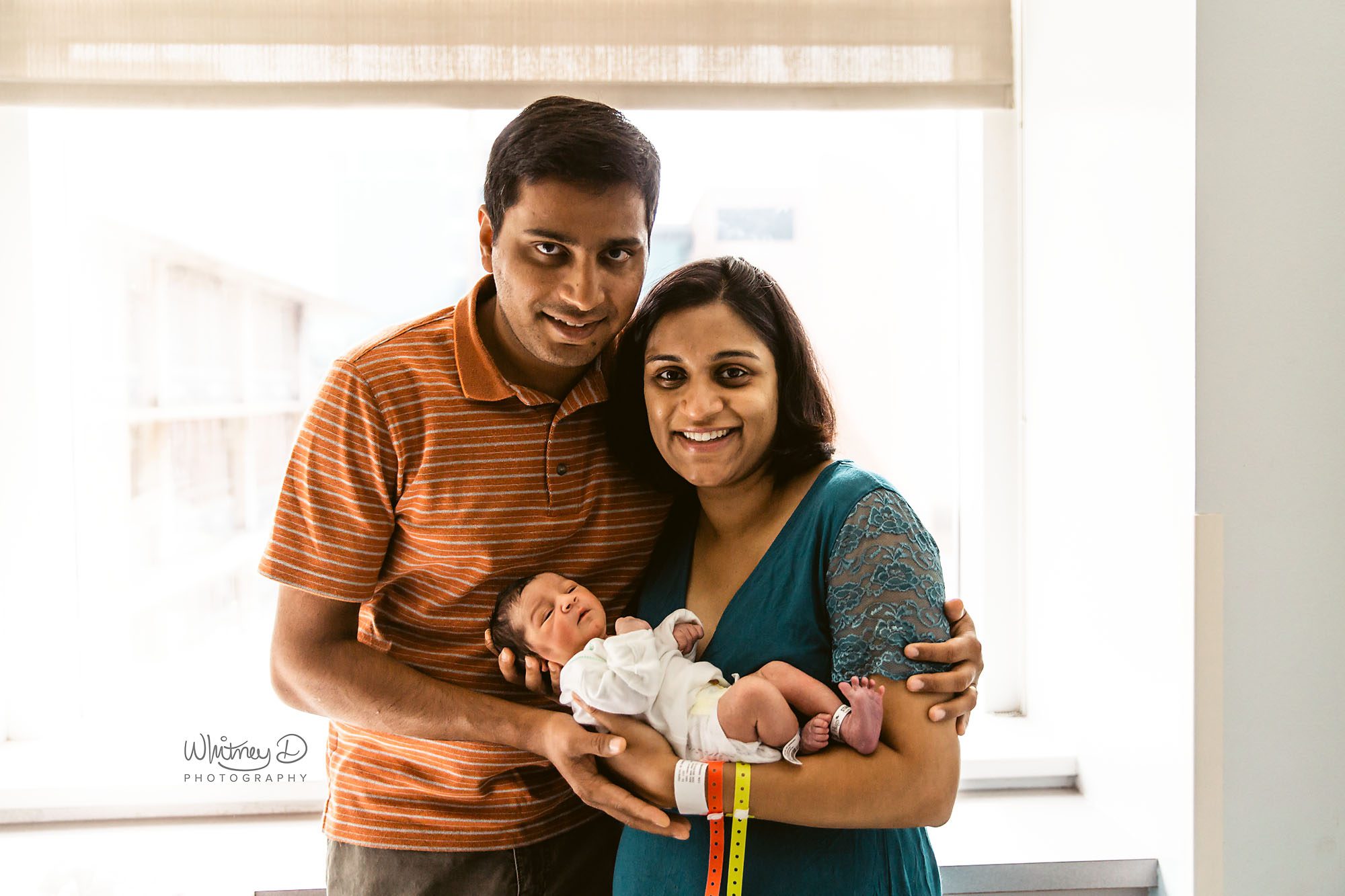 Newborn baby with mom and dad at hospital for fresh 48 session at UAMS
